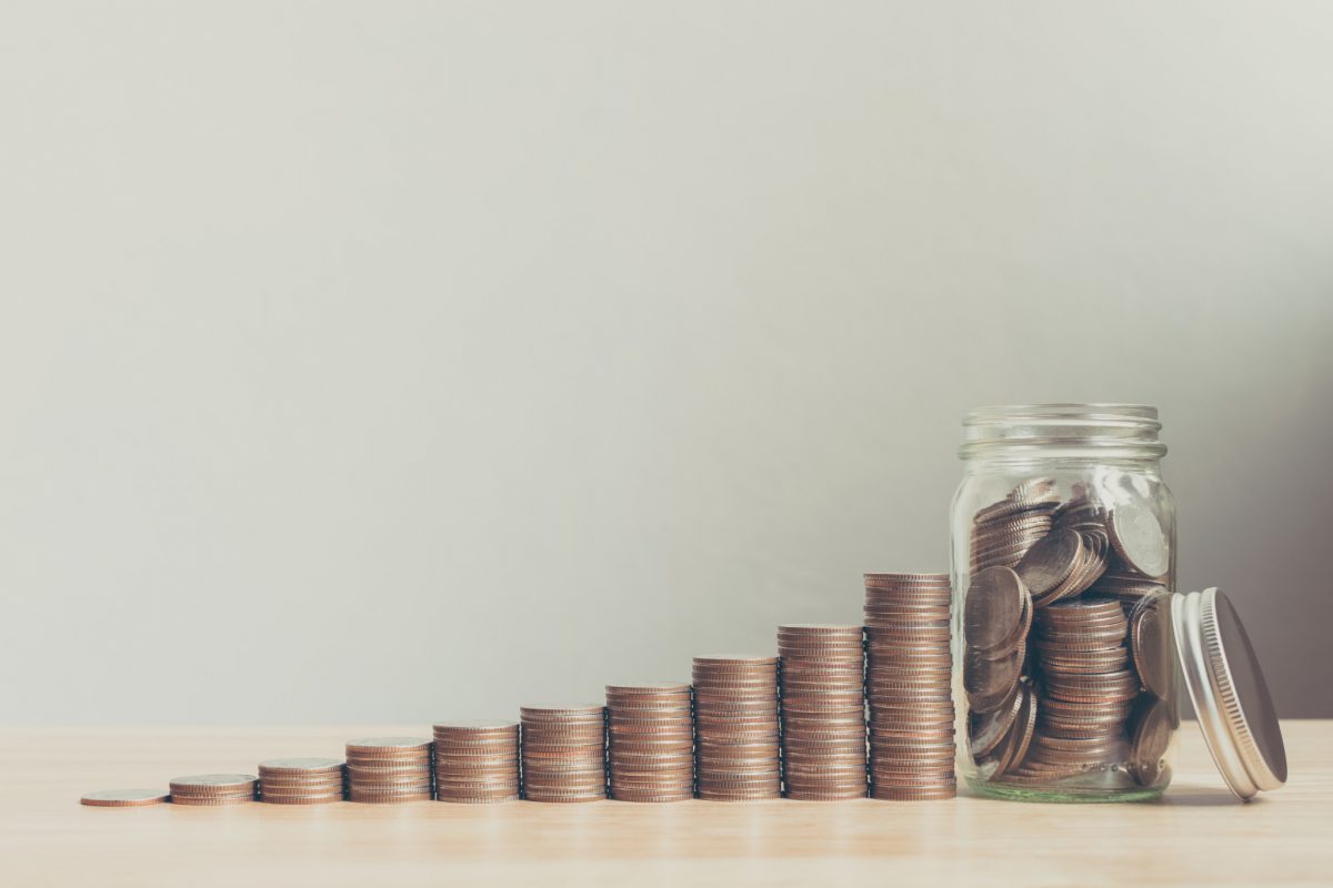 Coin,In,Glass,Bottle,With,Money,Stack,Step,Up,Growing